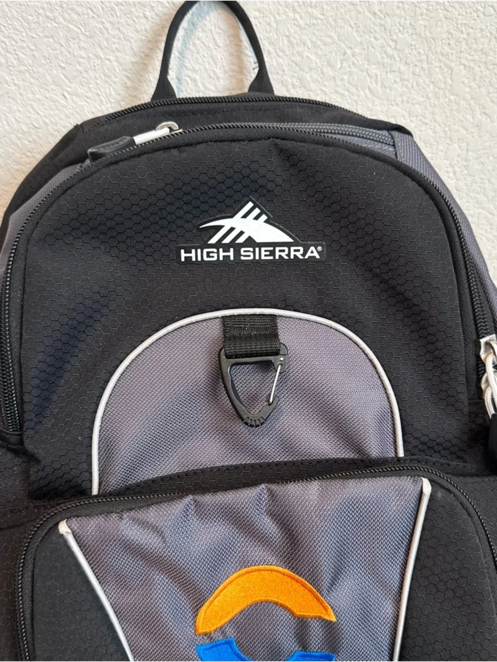 High Sierra Black and Gray Backpack with Blue and Orange Logo
